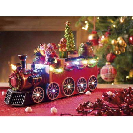 Weihnachtsmann im Zug mit bunten Lichtern und Musik - 