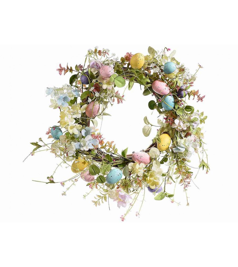 Ghirlanda pasquale decorativa con fiori e uova artificiali —